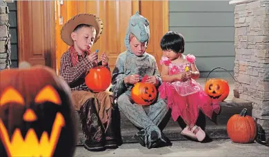  ?? GETTY IMAGES/ISTOCKPHOT­O ?? We should raise children who enjoy eating a variety of nutritious foods and can learn to eat in a balanced way, even when it comes to Halloween candy.