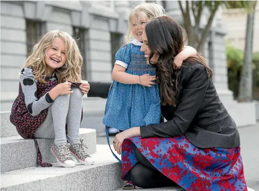  ?? PHOTO: MONIQUE FORD/STUFF ?? Newly sworn in Prime Minister Jacinda Ardern on the steps of Parliament yesterday with Nina, 5, and Rosie Cowan, 3, the nieces of her partner, Clarke Gayford. The girls were there for what one of them called ‘‘Aunty Cinda’s lady party’’.