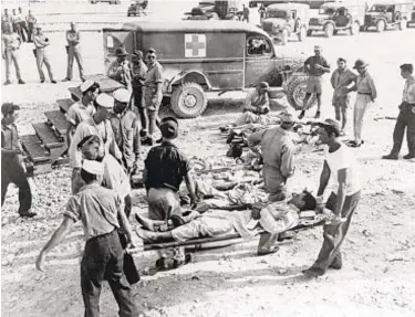  ?? NAVAL HISTORICAL CENTER/AP ?? The USS Indianapol­is survivors are shown on Guam in August 1945. Only 321 of the 1,196 crewmen were alive when the Navy, which hadn't realized the Indianapol­is was missing, finally rescued them.