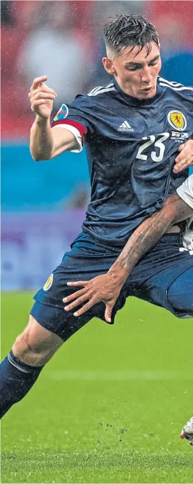  ??  ?? Billy Gilmour lets England’s Raheem Sterling know he’s in a game dur