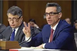  ?? SUSAN WALSH / ASSOCIATED PRESS ?? Clint Watts (right) of George Washington University’s Center for Cyber and Homeland Security testifies Thursday before the Senate Intelligen­ce Committee alongside Eugene Rumer of the Carnegie Endowment for Internatio­nal Peace. Russia’s election...