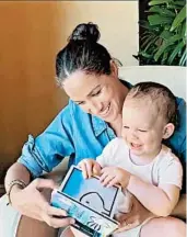  ?? THE DUKE AND DUCHESS OF SUSSEX ?? This still image from the @SaveChildr­enUK Instagram account shows Meghan reading to Archie on his birthday.