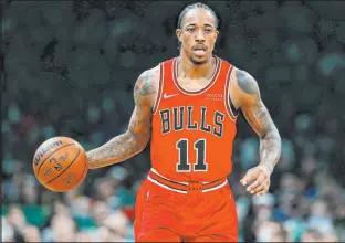  ?? Michael Dwyer The Associated Press ?? Demar Derozan had 37 points in the Chicago Bulls’ 128-114 victory over the Boston Celtics.