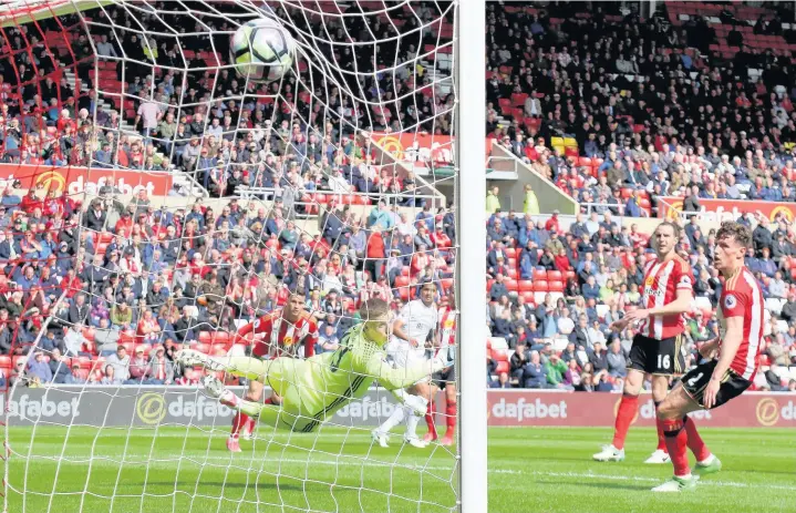  ??  ?? > Kyle Naughton flashes in a shot which proved the decisive moment during the Swans’ 2-0 win over Sunderland. Swans boss Paul Clement is pictured below