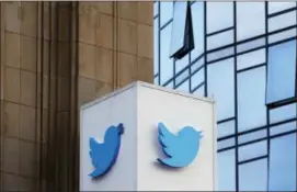  ?? JEFF CHIU ?? This Wednesday photo shows a Twitter sign outside of the company’s headquarte­rs in San Francisco.