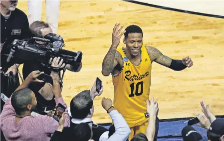  ??  ?? UMBC's Jairus Lyles celebrates after the upset of Virginia. PETER CASEY PETER CASEY, USA TODAY SPORTS