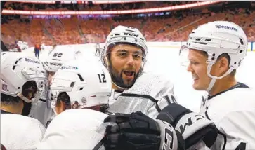  ?? Codie McLachlan Getty Images ?? THE KINGS’ ALEX IAFALLO, second from right, celebrates a goal in the Game 1 victory over the Oilers.