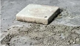  ?? Picture: REUTERS / SOE ZEYA TUN ?? DEBRIS: A close-up view of the spot where a plaque had been placed by Thai pro-democracy protesters near the Grand Palace in Bangkok. It declared that Thailand belonged to the people and not the king. The plaque was removed shortly afterwards.