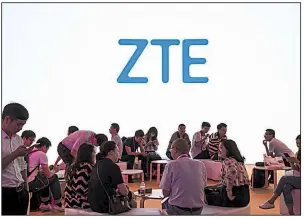  ?? Bloomberg News ?? A ZTE Corp. logo is displayed at a technical industry trade show in Shanghai in June. The removal of the U.S. ban on ZTE was a key demand of China as tension escalates between the countries.