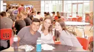  ?? RACHEL DICKERSON/MCDONALD COUNTY PRESS ?? Matthew Mora (left), Hailey Staib and Reese Walsh take their lunch break during freshman academy at McDonald County High School on Tuesday.