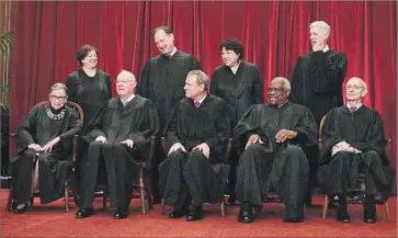  ?? Alex Wong Getty Images ?? THE SUPREME COURT this year, with Justice Neil M. Gorsuch replacing Antonin Scalia: front row, from left, Ruth Bader Ginsburg, Anthony M. Kennedy, Chief Justice John G. Roberts Jr., Clarence Thomas and Stephen G. Breyer; back row, from left, Elena...