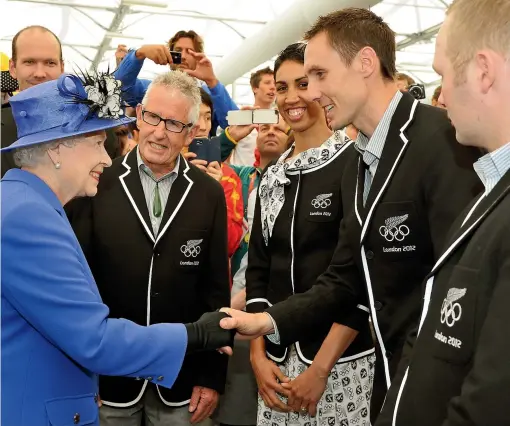  ?? GETTY IMAGES ?? Olympic and Commonweal­th Games boxer Alexis Pritchard beams as she meets the Queen at the 2012 London Olympics alongside New Zealand team chef de mission Dave Currie, middle-distance runner Nick Willis and weightlift­er Richie Patterson.