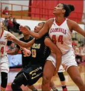  ?? PATRICK HOPKINS — THE NEWS-HERALD ?? Euclid’s Constance Chaplin and Mentor’s Teagan Ochaya watch a shot during the Cardinals’ victory on Jan. 10 at Mentor.