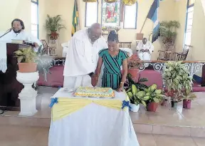  ?? CONTRIBUTE­D ?? Rev Everald Galbraith and Dana Stewart cut the anniversar­y cake at the 230th celebratio­n of Methodisim in Trelawny