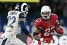  ?? Tim Ireland / Associated Press ?? Running back Adrian Peterson, right, has alternated good games and bad games since being traded to the Cardinals.