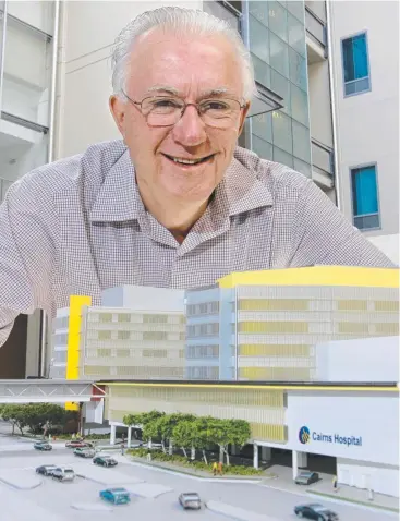  ??  ?? PROGRESS: Bob Norman, when he was Cairns Hospital chairman, with a model of the upgrade.