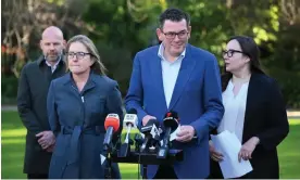  ?? Photograph: James Ross/AAP ?? Victorian premier Daniel Andrews (second right) speaks to the media during a press conference at Parliament House in Melbourne.