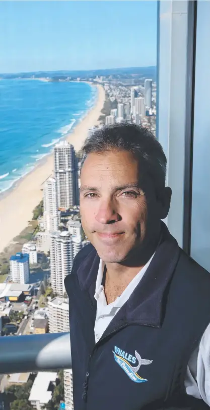  ?? Picture: GLENN HAMPSON ?? Gold Coast whale watcher Steven Evangelist­a at his perch atop the Q1 tower in Surfers Paradise.