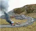  ??  ?? A burning car on the access road to Mt Hutt yesterday morning.