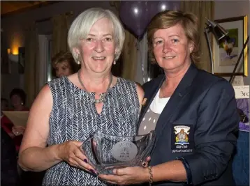  ??  ?? Mary McNamee (left) and Frances Byrne receive the second and third-place prizes in the Mannan Castle Lady Captain’s Prize from Lady Captain Deanna.