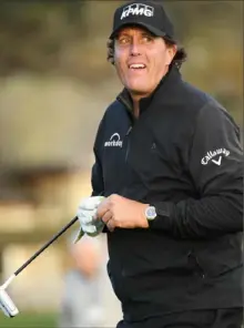  ?? Harry How/Getty Images ?? Phil Mickelson is poised to win his fifth Pebble Beach ProAm. Through 16 holes Sunday, he was 6 under for the round and led by three shots over Paul Casey.