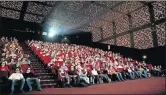  ?? Picture: REUTERS ?? CINEMA POTATOES: People watch a rugby match between England and France at a cinema in France in 2010.