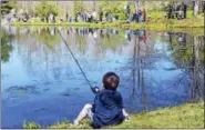  ?? FILE PHOTO ?? More than 200 children tried their hands at catching trout during the city’s fishing derby last year at Butternut Hollow Park in Middletown.