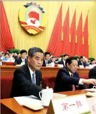  ?? PHOTOS BY XINHUA ?? Chief Executive Leung Chun-ying (left) sits on the rostrum after he was elected vice-chairman of the 12th CPPCC National Committee at the closing session in the Great Hall of the People in Beijing on Monday.