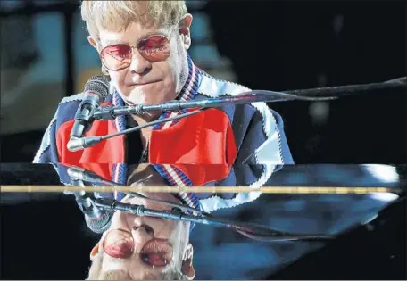  ?? Photograph­s by Carolyn Cole Los Angeles Times ?? ELTON JOHN rehearses for the telecast of the 60 Grammy Awards as the presentati­on moves to New York’s Madison Square Garden.