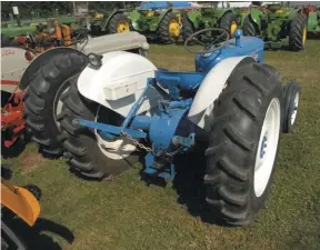  ??  ??  From the working end, the 540 RPM PTO and 3-point lift were standard items, as was a swinging drawbar, which appears to be missing on this tractor. Though a PTO was standard, it wasn’t the live version, which was optional. This tractor doesn’t have them, but power adjusted rear wheels were available to make track width changes easy.