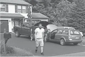  ??  ?? Michael Rotondo, 30, prepares to leave his parents’ house in Camillus, N.Y., on Friday. He was a few hours ahead of a a court-ordered eviction deadline. DOUGLASS DOWTY/THE POST-STANDARD VIA AP