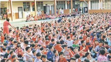  ??  ?? Pupils of CHPS No.5 react to a festive song at the gathering.