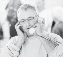  ?? TORONTO STAR FILE PHOTO ?? Ben Baillargeo­n works the phones at Mohawk Racetrack, Campbellvi­lle.