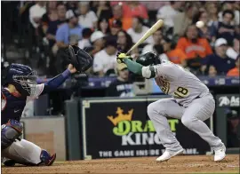  ?? DAVID J. PHILLIP — THE ASSOCIATED PRESS ?? The Athletics’ Chad Pinder (18) ducks to avoid a pitch thrown by Houston Astros pitcher Bryan Abreu during Monday night’s 15-0loss in Houston.