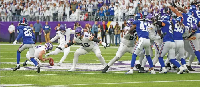  ?? BRUCE KLUCKHOHN/AP ?? Greg Joseph boots a career-long 61-yard field goal on the last play of the game to give the Vikings an NFL record 11th one-score win this season. The loss prevented the Giants from clinching a playoff spot.