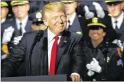  ?? SPENCER PLATT / GETTY IMAGES ?? President Donald Trump speaks in Brentwood, N.Y., close to where the violent street gang MS-13 has committed a number of killings. He urged Congress to dedicate more funds to border enforcemen­t.