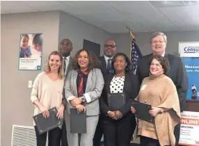  ?? SARAH MACARAEG/THE COMMERCIAL APPEAL ?? Public officials including Shelby County Mayor Lee Harris, back left, and Memphis Mayor Jim Strickland, back right, kick off 2020 Census efforts with local staffers and community partners.