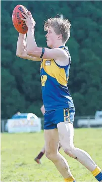  ??  ?? Ellinbank’s Mathew Notman marks during the match against Warragul Industrial­s