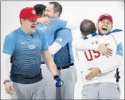  ?? Carlos Gonzalez Minneapoli­s Star Tribune ?? TEAM USA CELEBRATES after defeating Sweden in the final for the Americans’ first curling gold.