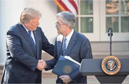  ?? DREW ANGERER/GETTY IMAGES ?? President Donald Trump shakes hands with Jerome Powell, his nominee for chairman of the Federal Reserve, on Thursday at the White House.