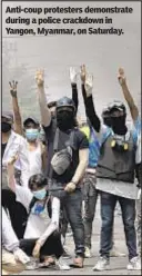  ??  ?? Anti-coup protesters demonstrat­e during a police crackdown in Yangon, Myanmar, on Saturday.