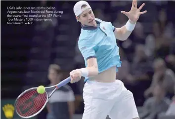  ?? — AFP ?? USA’s John Isner returns the ball to Argentina’s Juan Martin del Potro during the quarterfin­al round at the ATP World Tour Masters 1000 indoor tennis tournament.