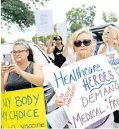  ?? YANA PASKOVA/THE NEW YORK TIMES ?? People protest vaccine mandates for health care workers at Staten Island University Hospital, Northwell Health on Staten Island in New York City on Aug. 16. Similar protests have been held in Orange County, featuring Orange County Fire Rescue firefighte­rs and paramedics.