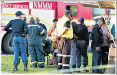  ??  ?? DRAMATIC SCENES: Smoke billows above the valley after the aircraft crashed about 50m from The Knysna luxury apartment complex yesterday, while rescue workers attend the scene and onlookers gather below