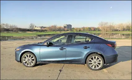  ?? ROBERT DUFFER / CHICAGO TRIBUNE ?? Changes to the 2017 Mazda3 compact sedan are subtle but improve Mazda’s already renowned handling.