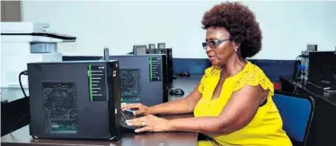  ?? ?? Mbuyiseni High School Principal, Mrs ZS Shange, enjoying the new computer laboratory