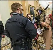  ?? MANUEL BALCE CENETA — THE ASSOCIATED PRESS FILE ?? An Arizona man seen in photos and video wearing a fur hat with horns was also charged Saturday in Wednesday’s chaos. Jacob Anthony Chansley, who also goes by the name Jake Angeli, was taken into custody Saturday.