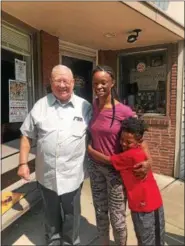  ?? PHOTO COURTESY OF LATASHA JONES ?? Latasha Jones stands with her son, Elijah, and former firefighte­r Frank Thees. Jones met Thees 28 years after he saved her life in a fire in 1990 when Jones was just 2 years old.