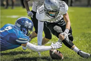  ??  ?? Horsemen Devin Flores, left, snags a fumble in the end zone for a touchdown before the Jaguars’ Andrew Rodriguez can get a hand on it Saturday.