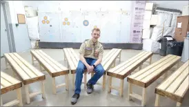  ?? Photo submitted ?? Tyler Luckenbill is shown with the eight benches he constructe­d for Bucktail Archers for his Eagle Scout project.